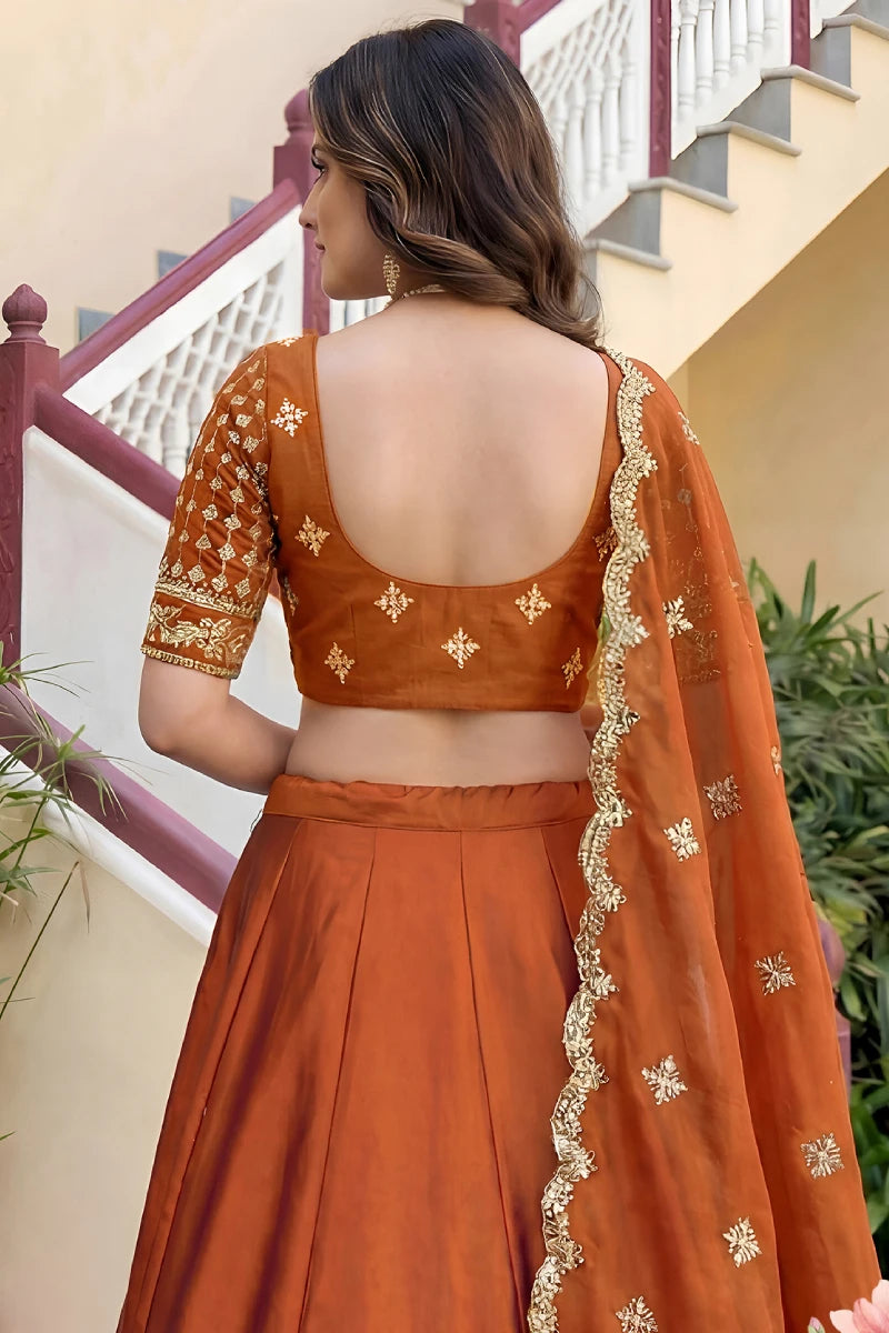 Rust Orange Rangoli Silk Embroidered Lehenga Choli
