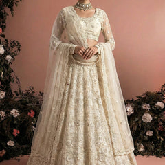 Off White Net Heavy Embroidered Wedding Lehenga