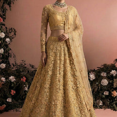 Beige Net Heavy Embroidered Wedding Lehenga